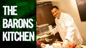 Smiling Chef Coking Food at Restaurant Kitchen