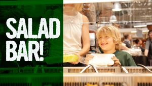 Smiling Kid Holding Food Container at Salad Bar