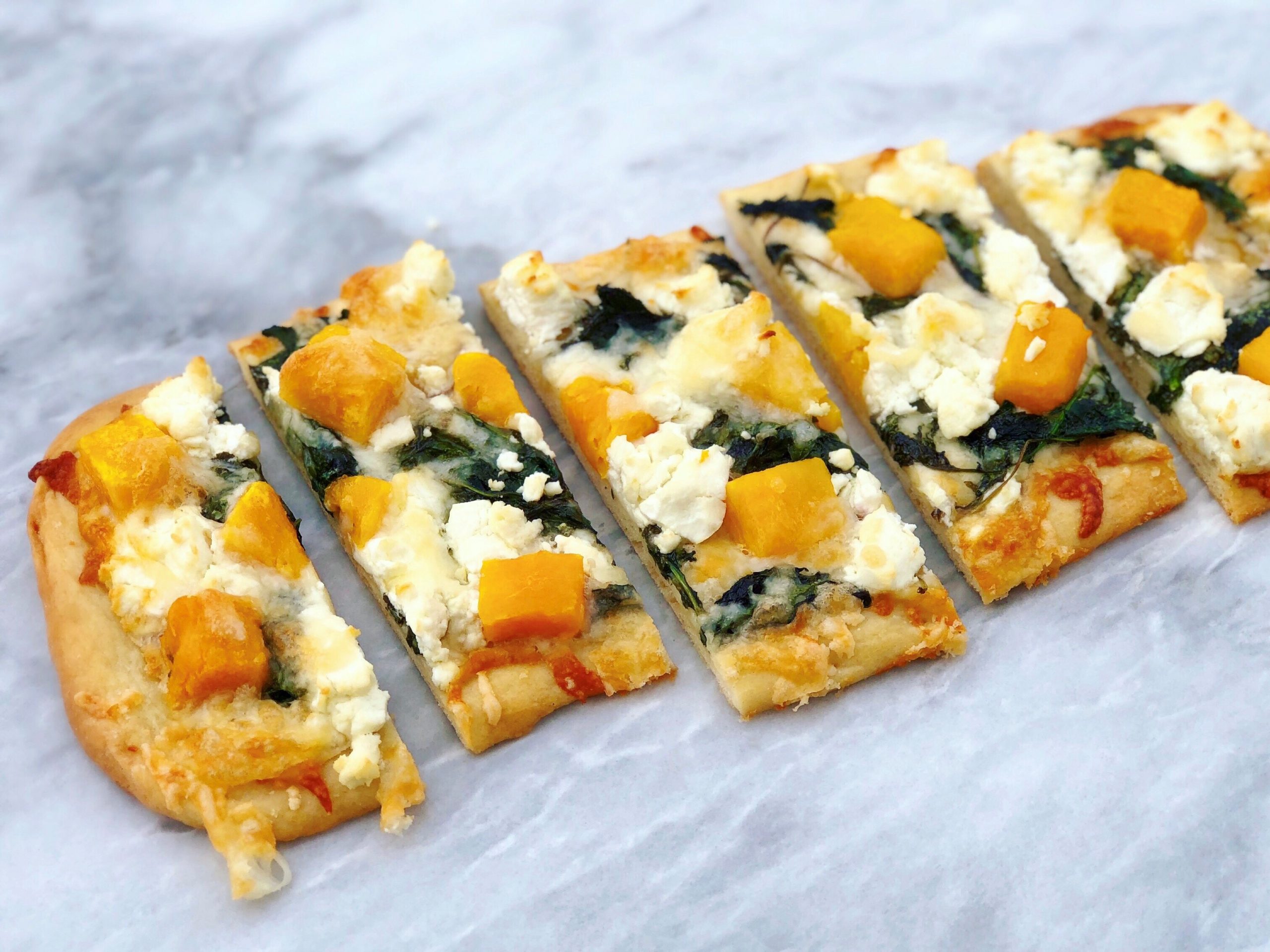 Dish of Butternut Squash, Kale, and Goat Cheese Flatbread