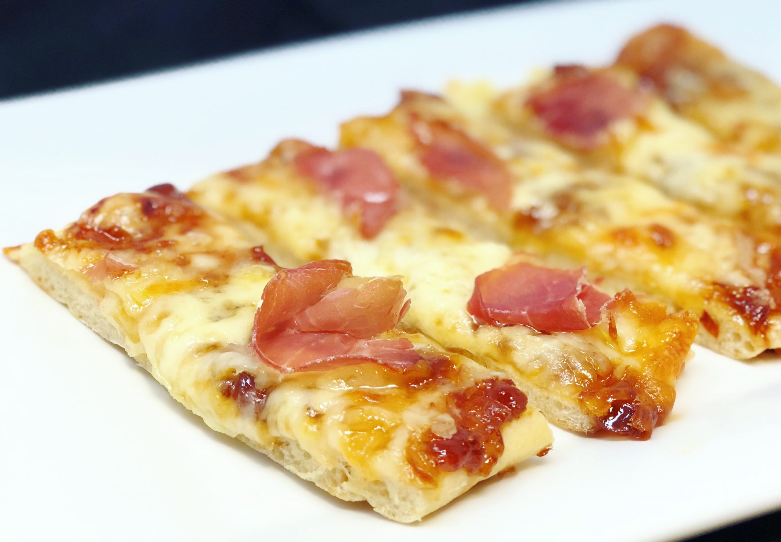 Dish of Fontina and Prosciutto Flatbread with Balsamic Onion Jam