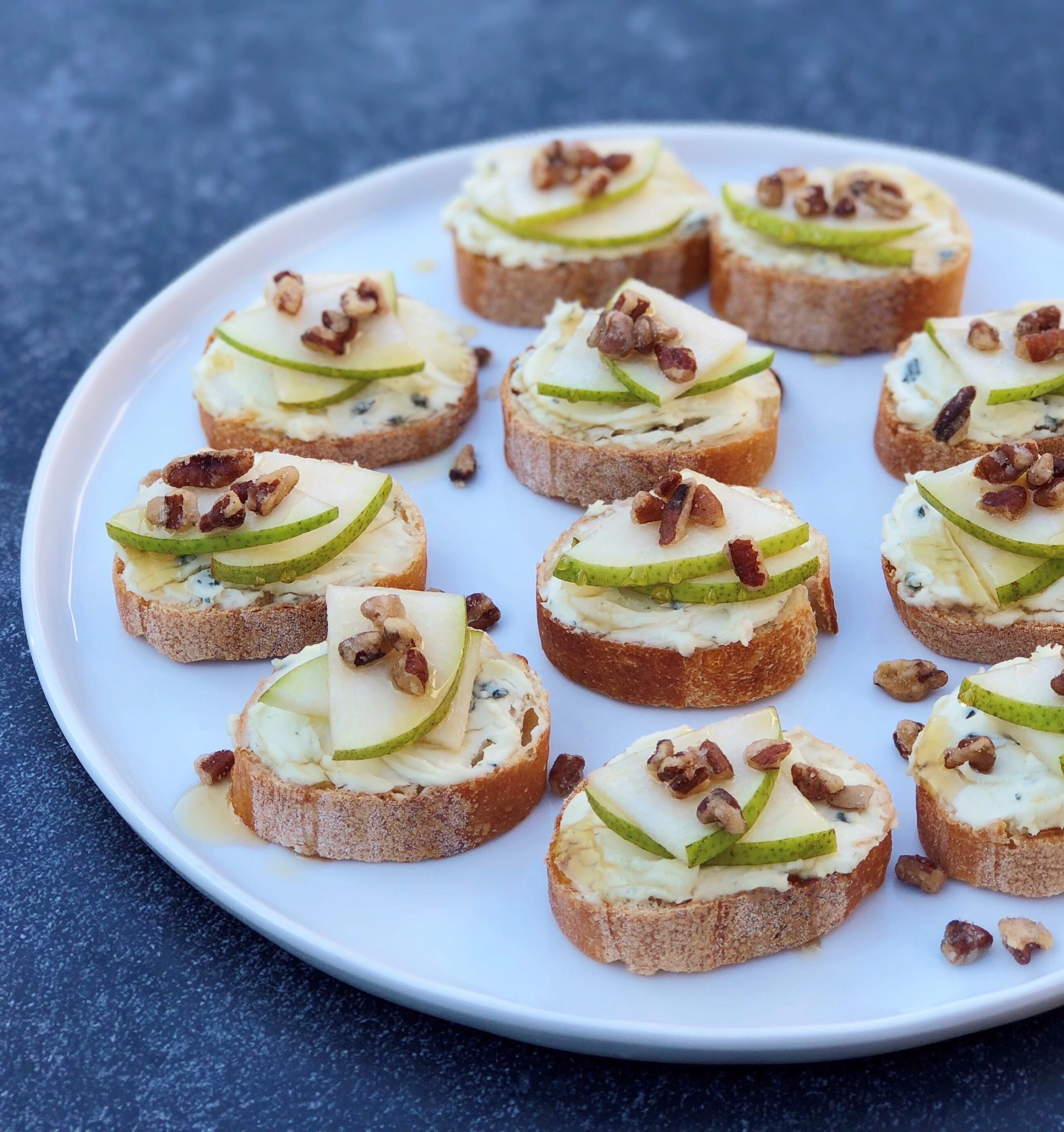 Dish of Pear and Cambozola Crostini with Honey