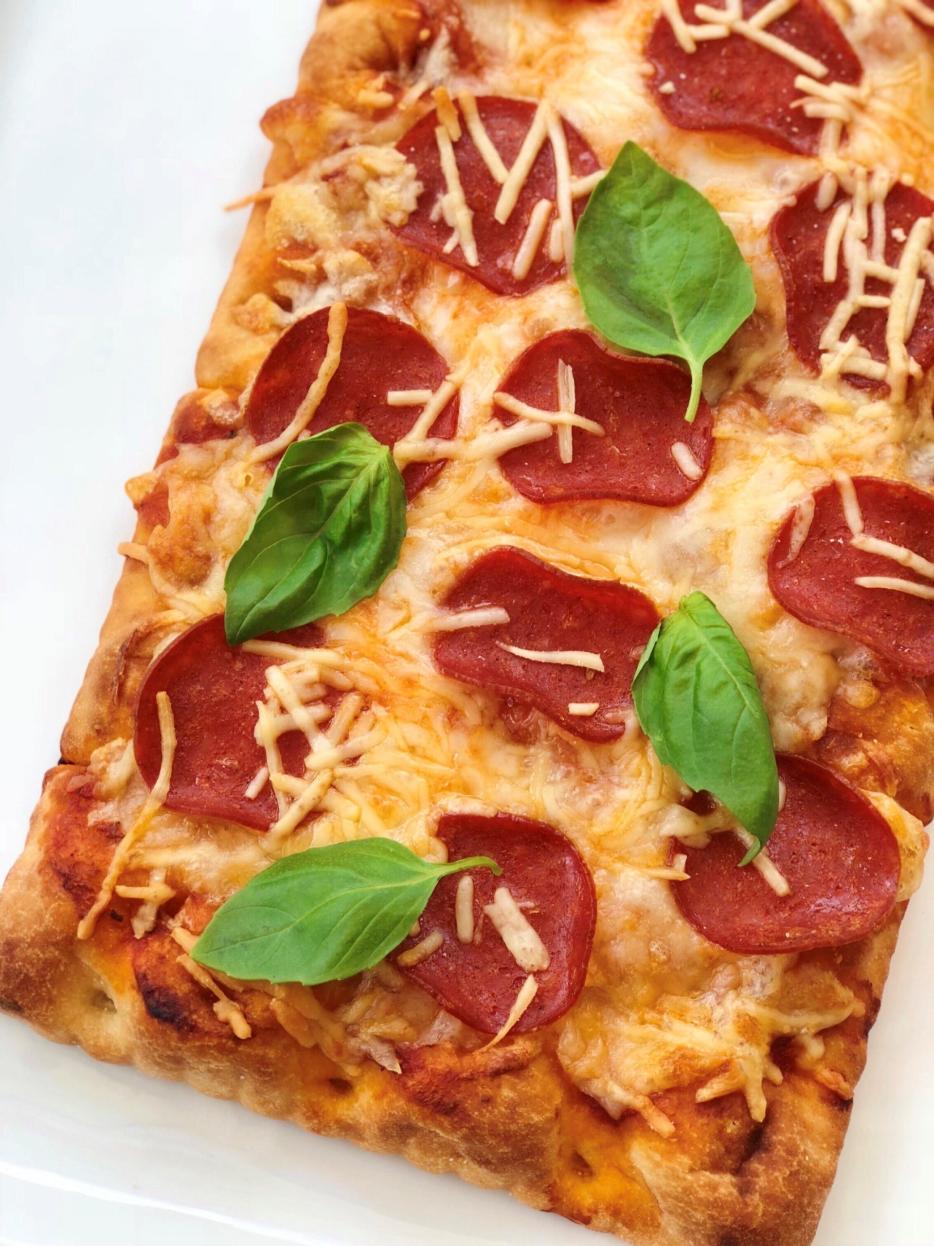 Dish of Pepperoni and Basil Pizza