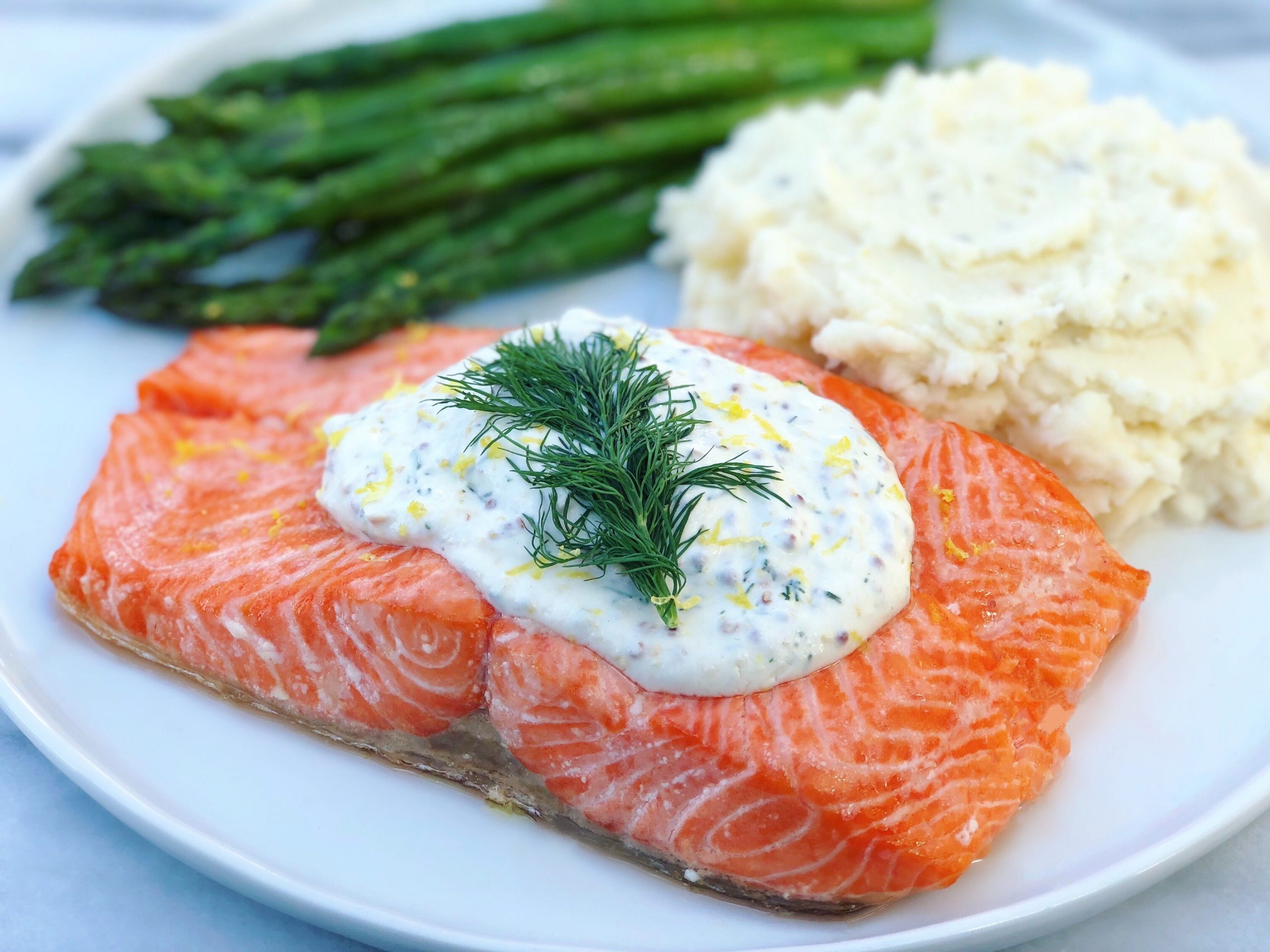 Dish of Baked Salmon with Creamy Dill Mustard Sauce