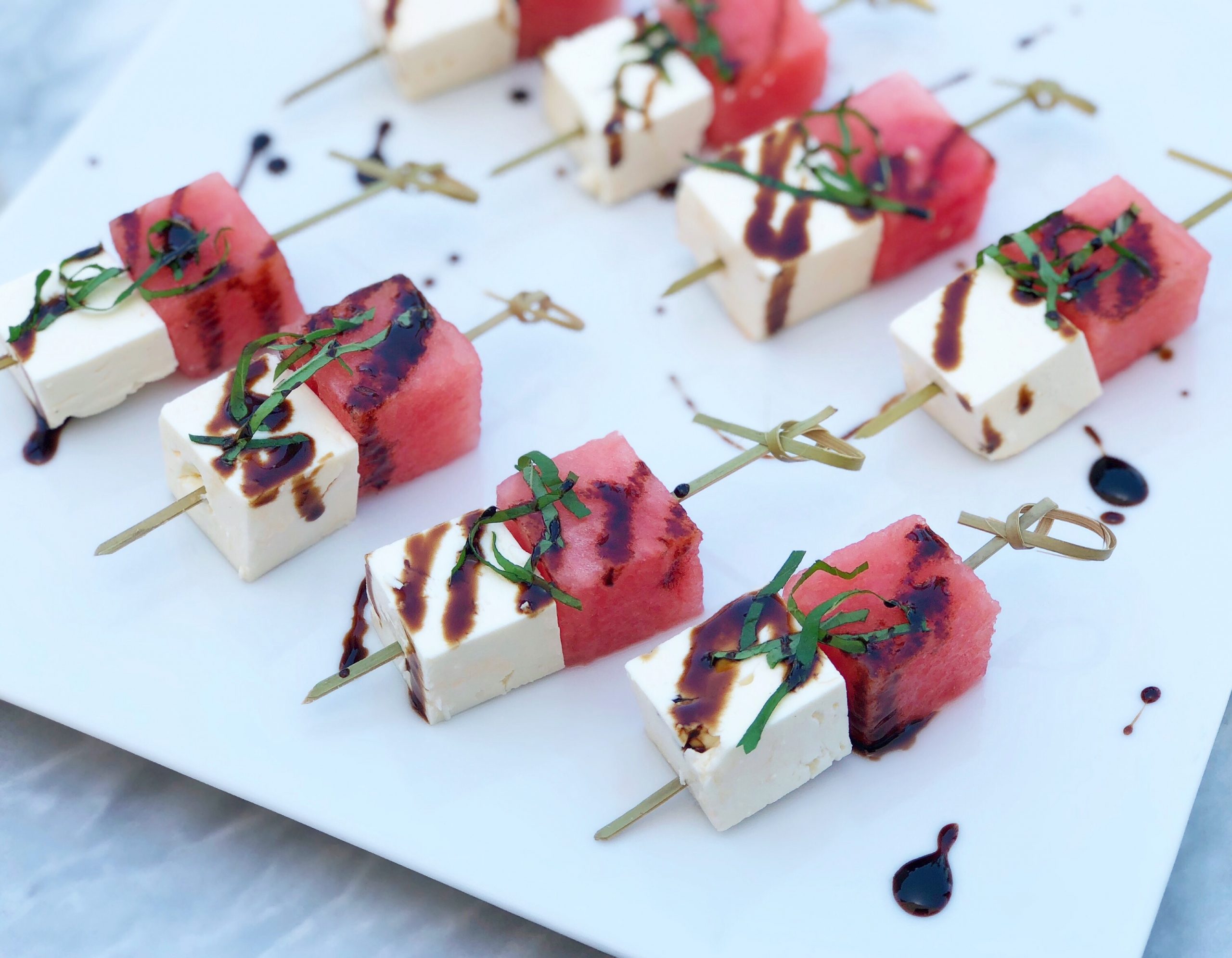 Dish of Watermelon, Feta, and Mint Skewers with Balsamic Vinegar