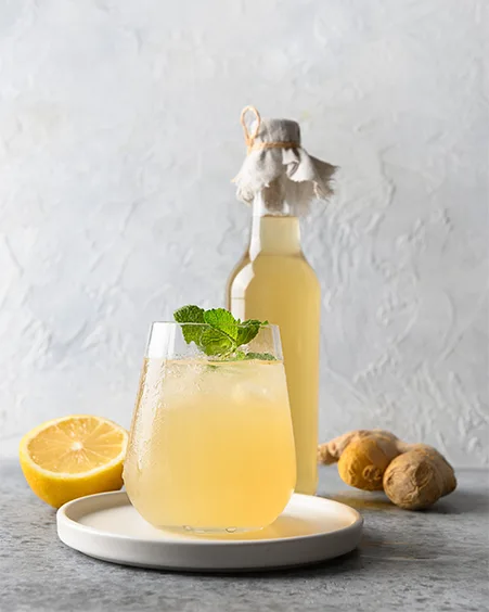 goldenroot ginger beer in glass and bottle with lemon and ginger