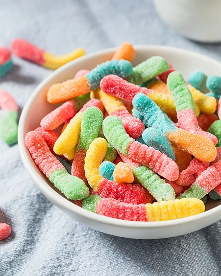 Sweet Sugary Sour Gummy Worms in a Bowl